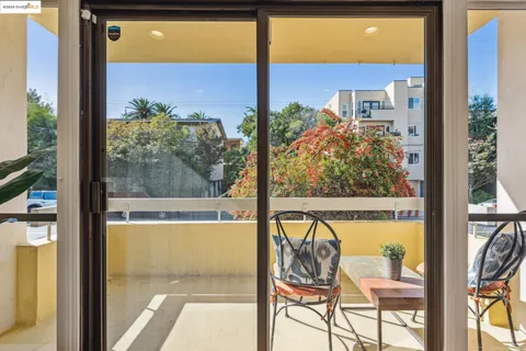 a view of a room with a large window and front table