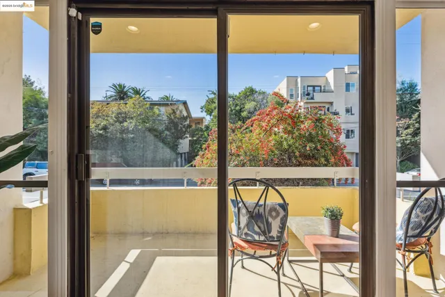a view of a room with a large window and front table