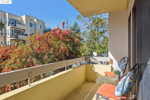 a view of a balcony with chairs