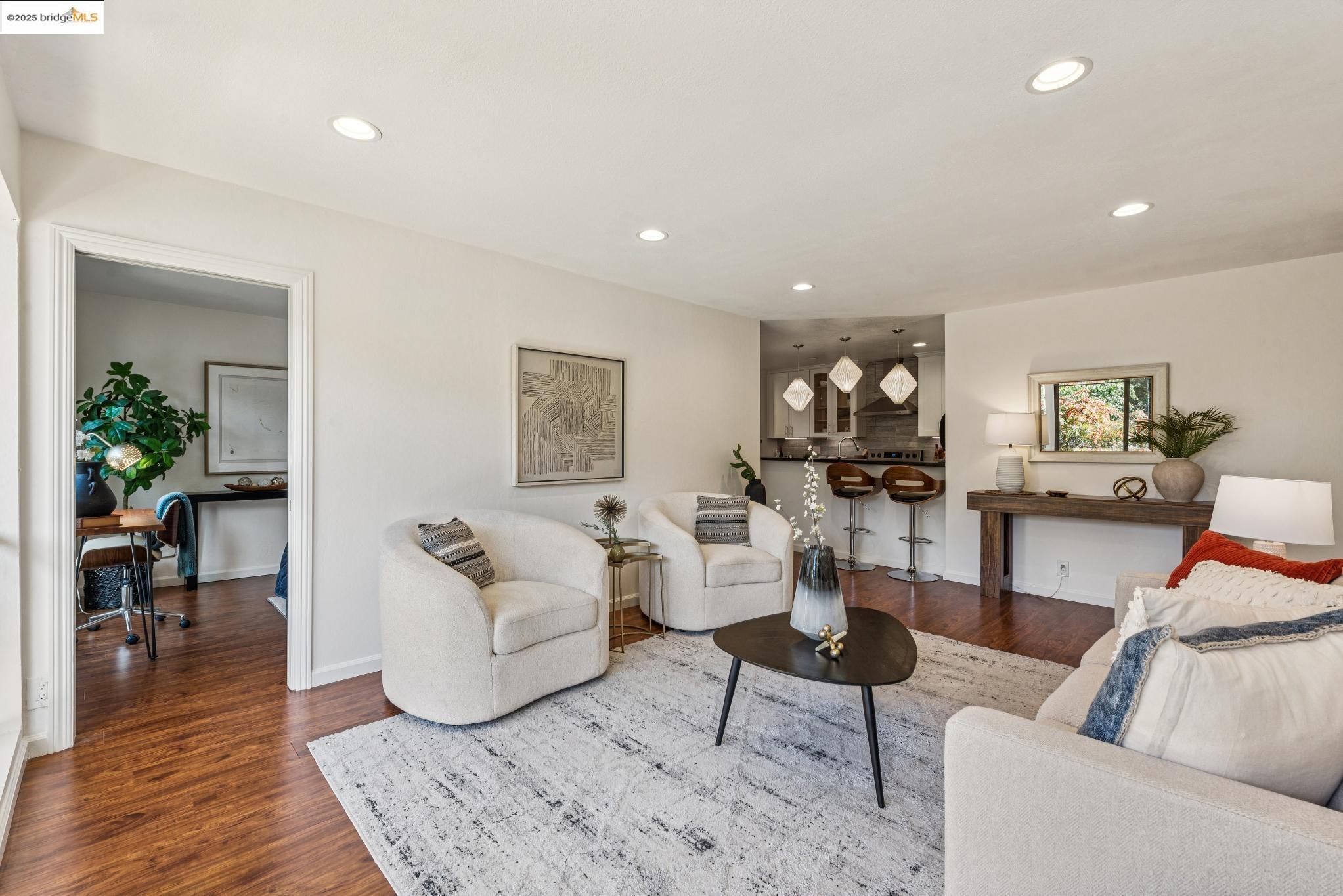 651 Oakland Avenue, Unit 1E Oakland, CA 94611 - Photo 7 of 28 a living room with furniture and a wooden floor