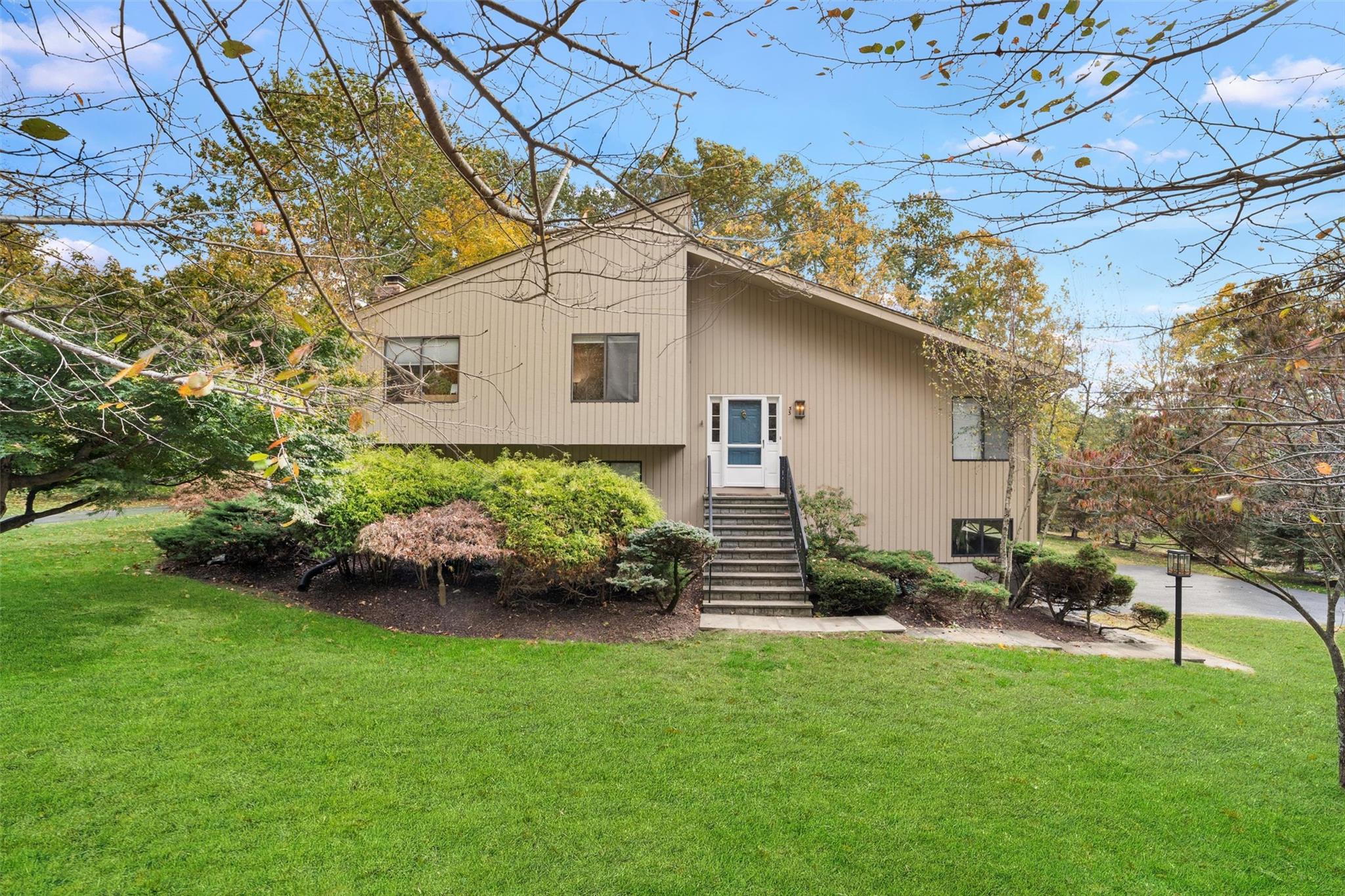 33 Cross Road Cortlandt Manor, NY 10567 - Photo 1 of 1 Rear view of property featuring a yard