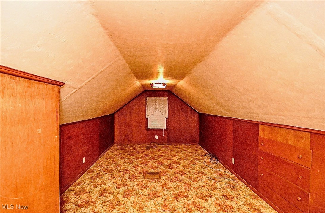 4858 Arbor Road Southwest Canton, OH 44710 - Photo 26 of 31 Additional living space with vaulted ceiling and carpet floors
