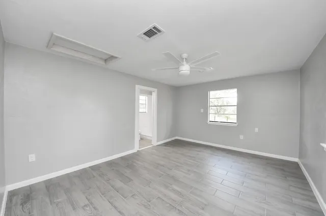 a view of an empty room with a window