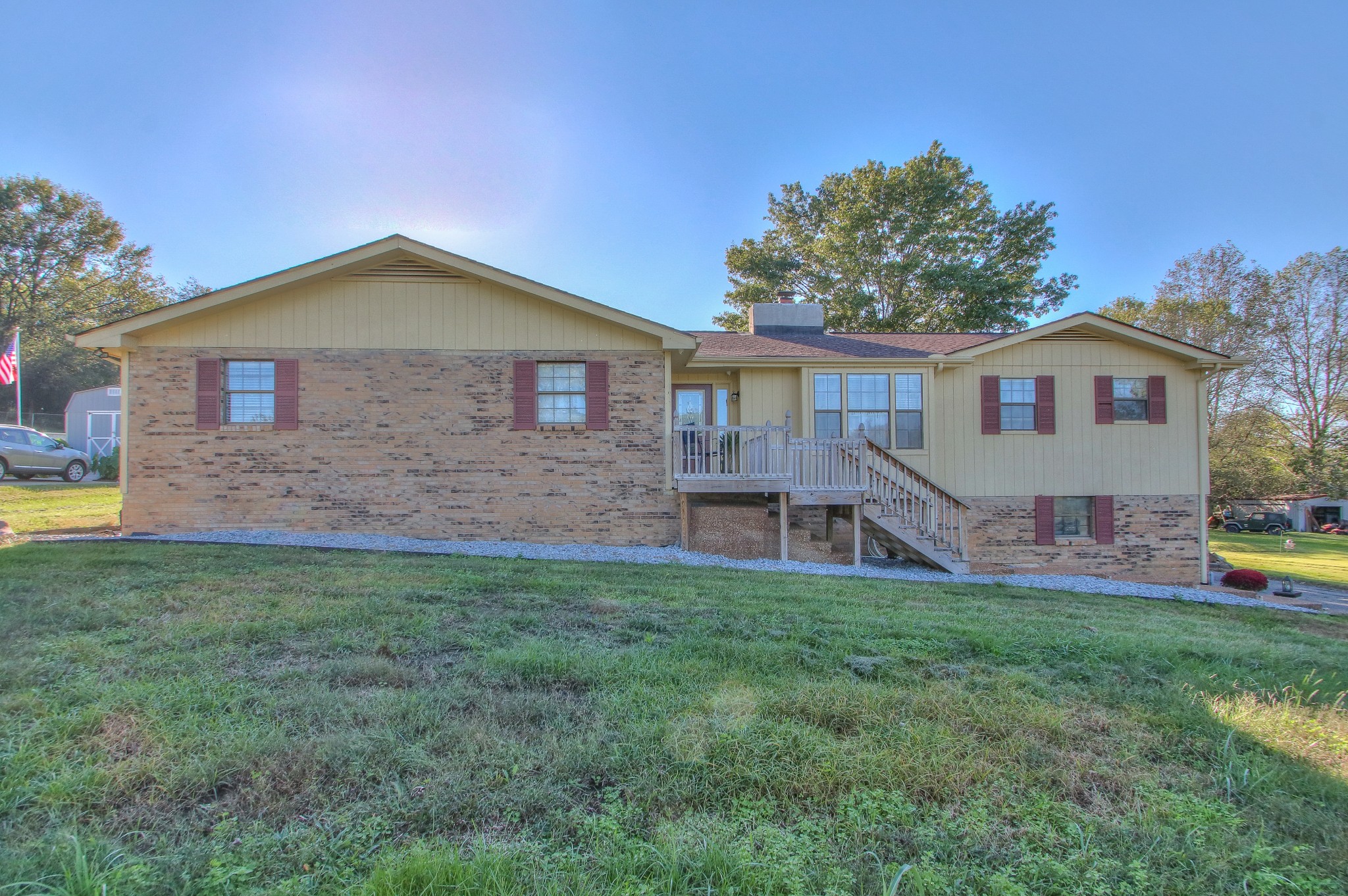 416 Harsh Lane Castalian Springs, TN 37031 - Photo 1 of 31 a front view of a house with a yard and trees