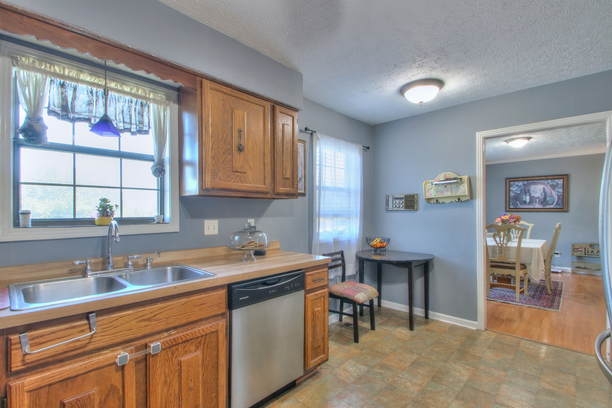 416 Harsh Lane Castalian Springs, TN 37031 - Photo 11 of 31 a kitchen with a sink cabinets and wooden floor