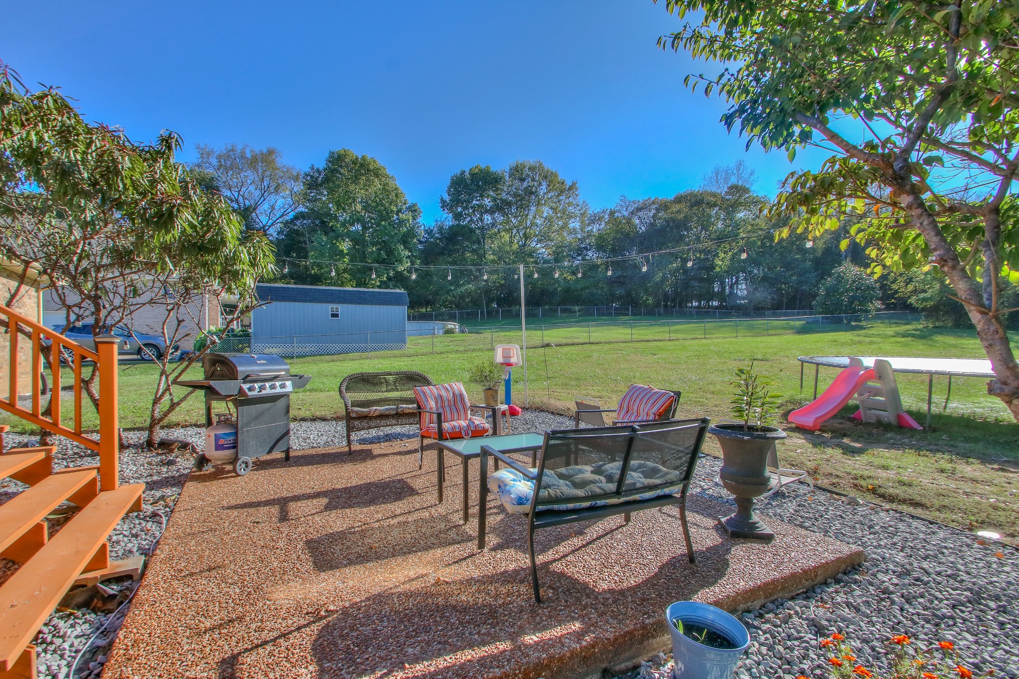 416 Harsh Lane Castalian Springs, TN 37031 - Photo 27 of 31 an outdoor sitting area with couch and wooden fence