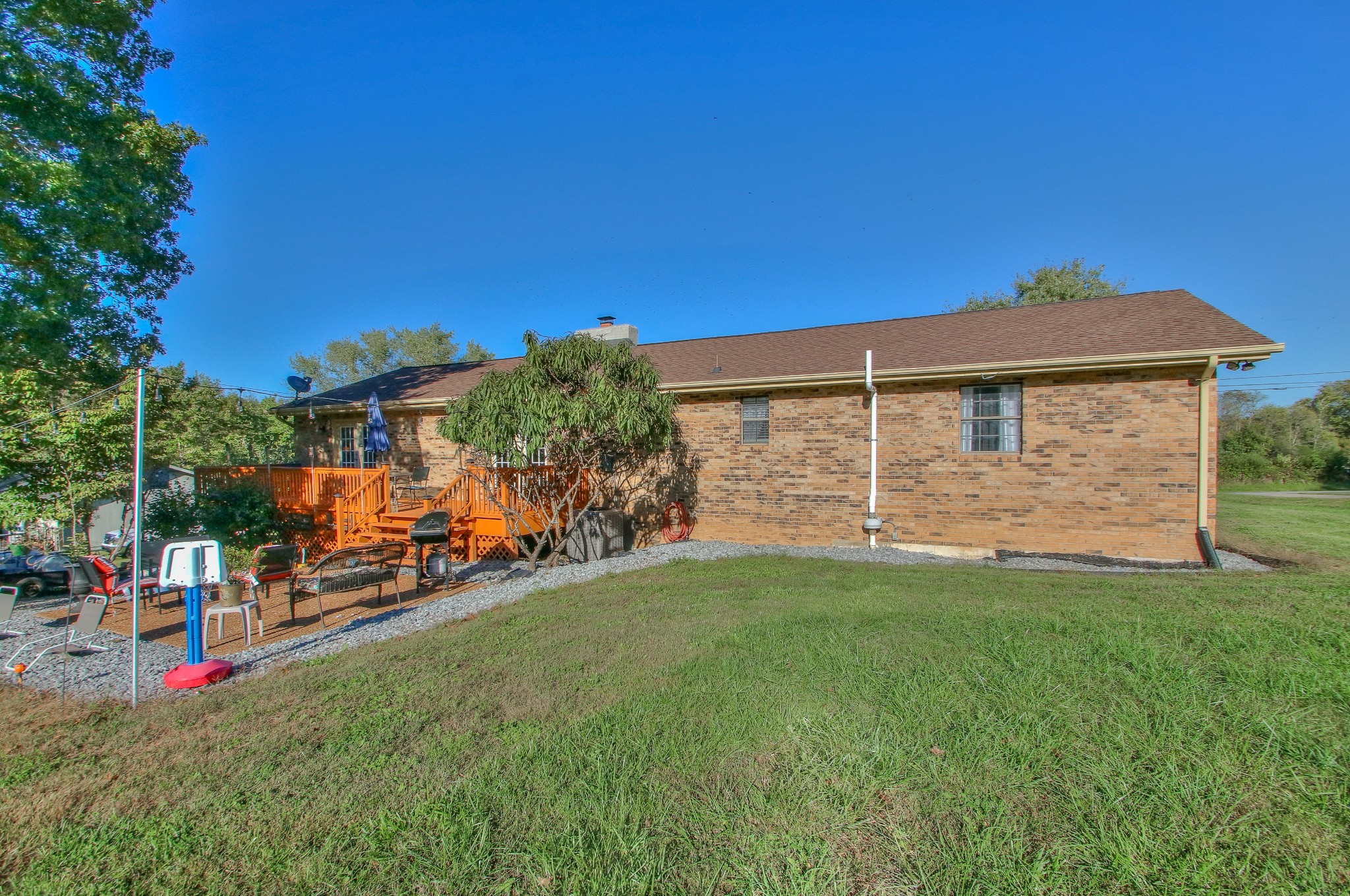 416 Harsh Lane Castalian Springs, TN 37031 - Photo 30 of 31 a view of a house with a backyard