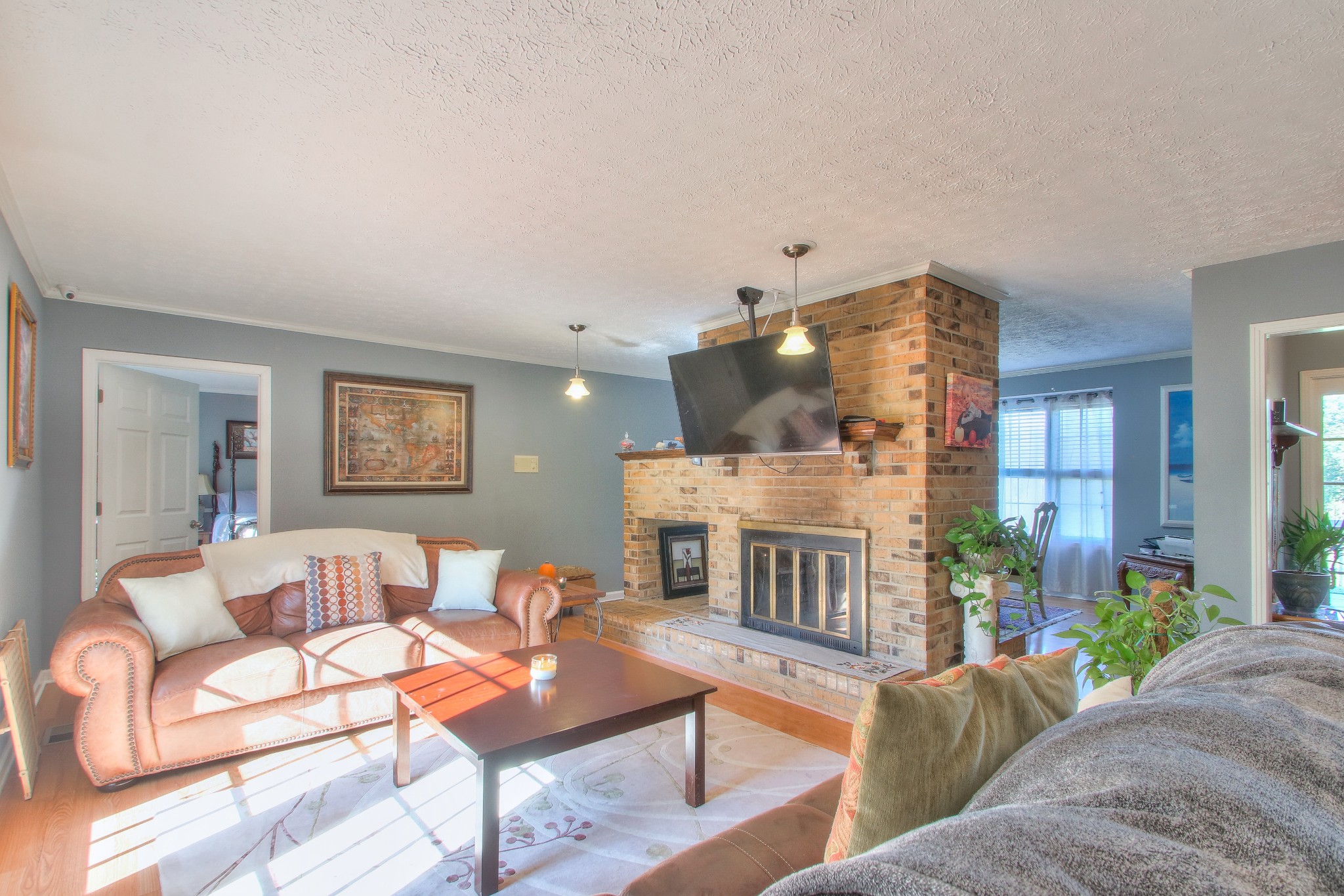 416 Harsh Lane Castalian Springs, TN 37031 - Photo 6 of 31 a living room with furniture and a fireplace