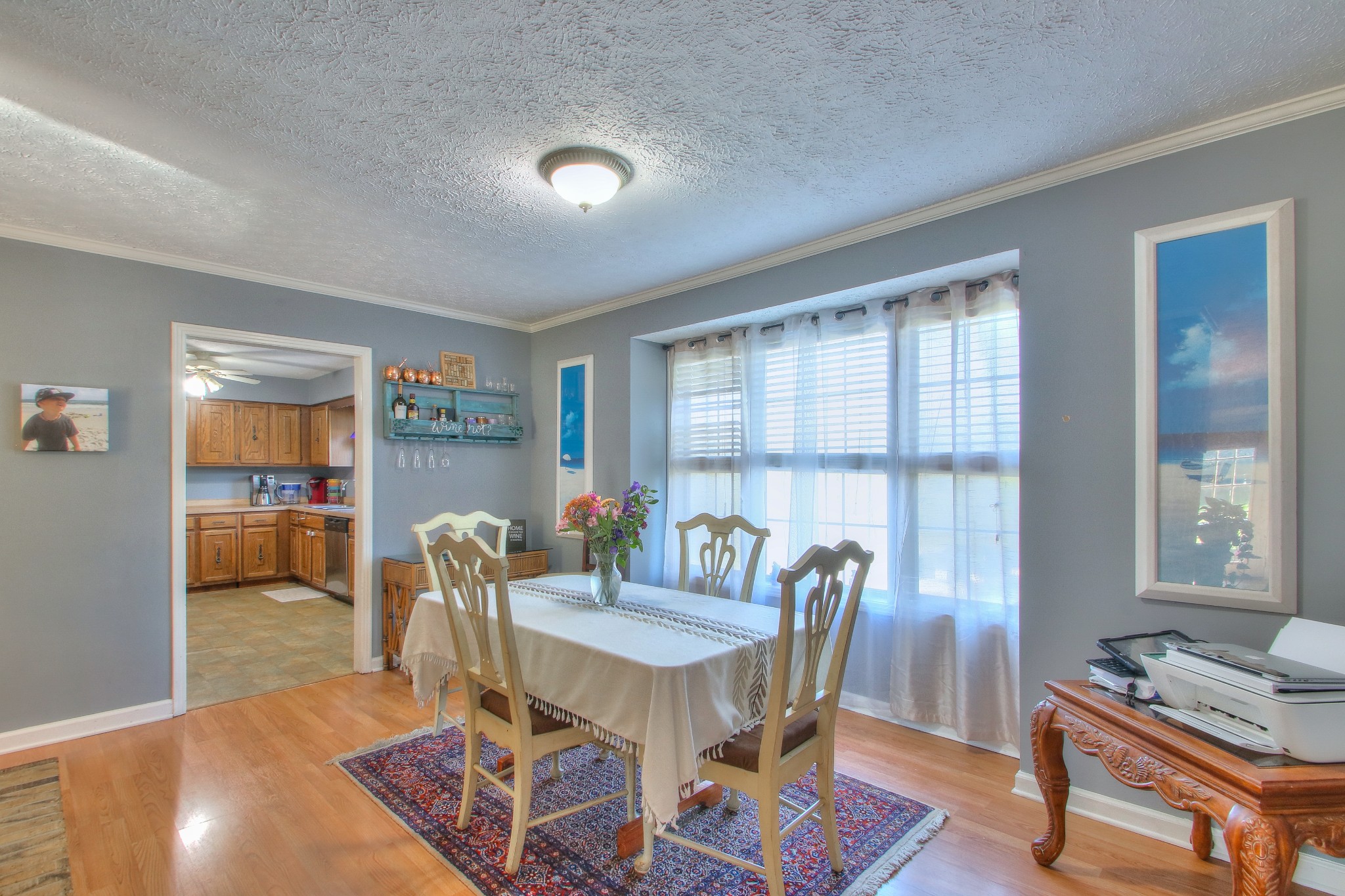 416 Harsh Lane Castalian Springs, TN 37031 - Photo 9 of 31 a view of a dining room with furniture and wooden floor