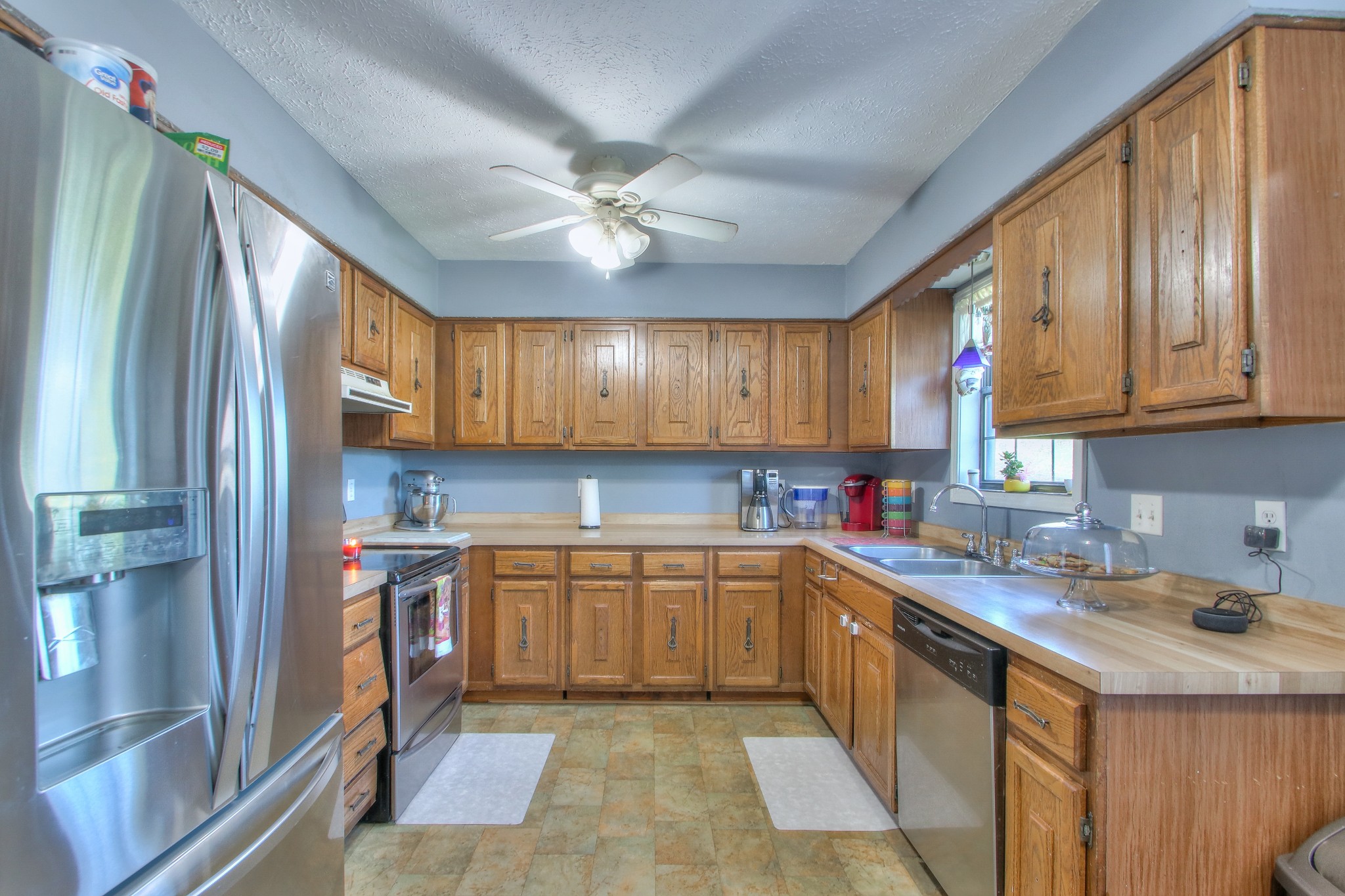 416 Harsh Lane Castalian Springs, TN 37031 - Photo 10 of 31 a kitchen with stainless steel appliances granite countertop a sink stove and refrigerator