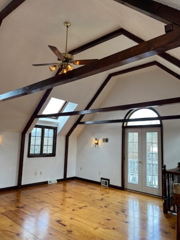 16 A Stowe Road, Unit A Southborough, MA 01772 - Photo 2 of 10 a view of a livingroom with wooden floor and a ceiling fan