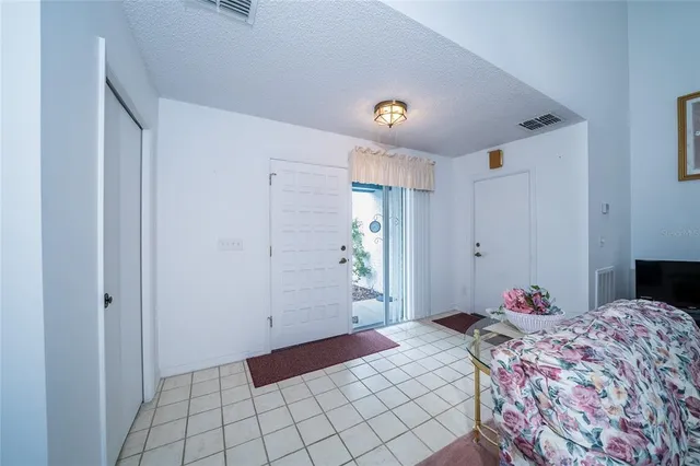 a bedroom with a bed and a table