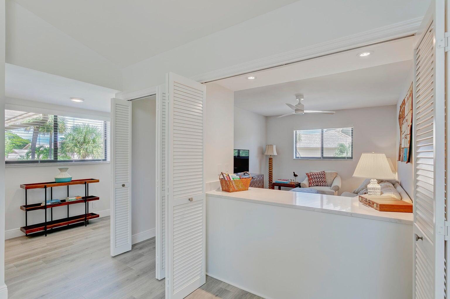 17053 Waterbend Drive, Unit 231 Jupiter, FL 33477 - Photo 11 of 26 a dining room with furniture and a window