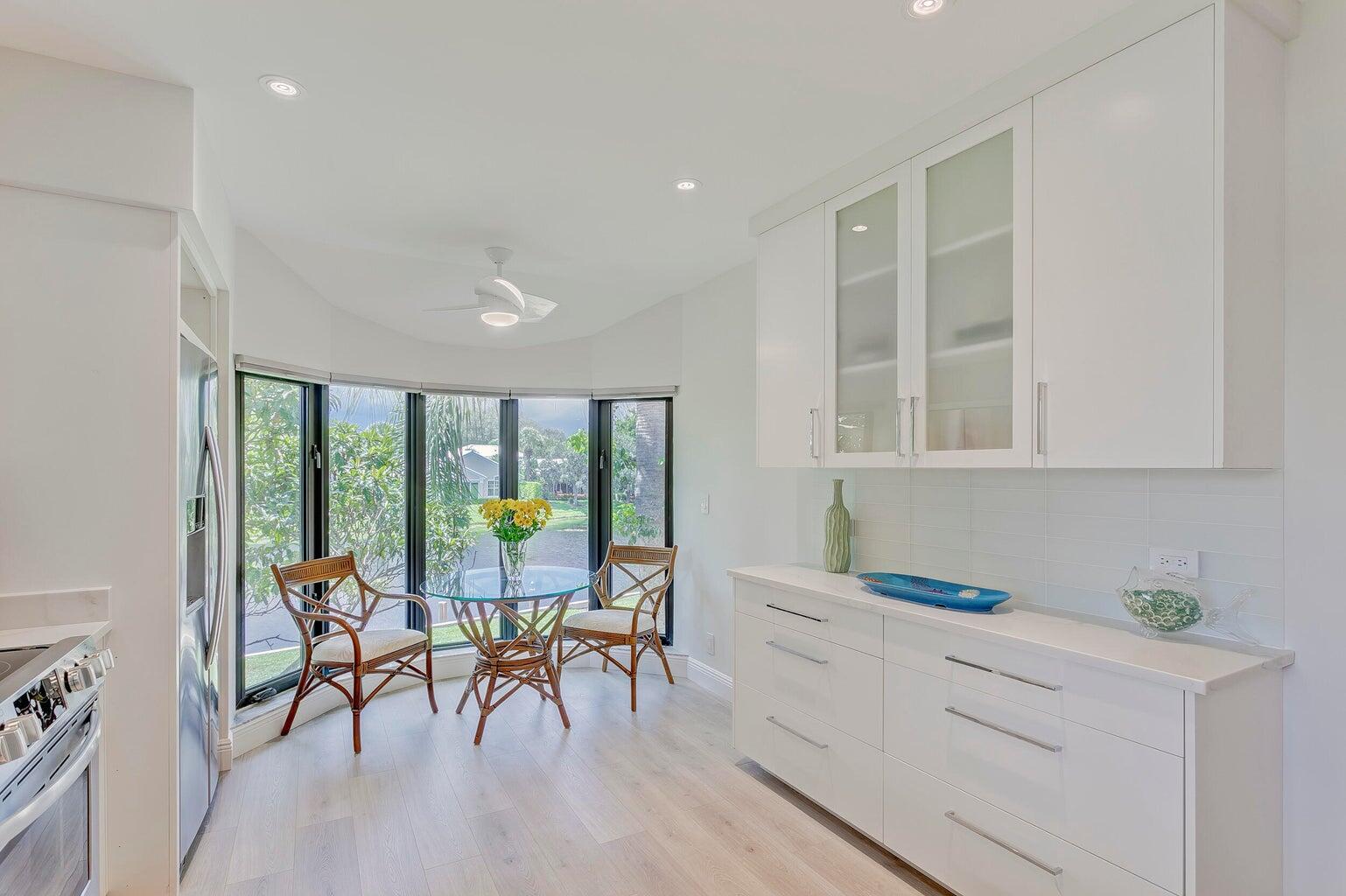 17053 Waterbend Drive, Unit 231 Jupiter, FL 33477 - Photo 9 of 26 a living room with furniture and a large window