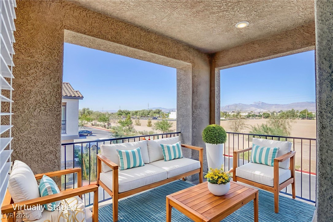 7230 North Decatur Boulevard, Unit 6 North Las Vegas, NV 89084 - Photo 9 of 27 Balcony virtual stage featuring an outdoor living space and a mountain view