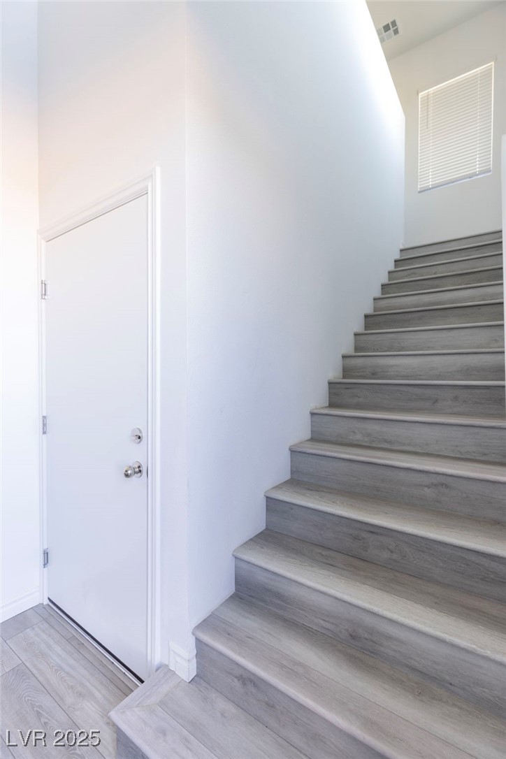 7230 North Decatur Boulevard, Unit 6 North Las Vegas, NV 89084 - Photo 20 of 27 Stairway featuring wood finished floors