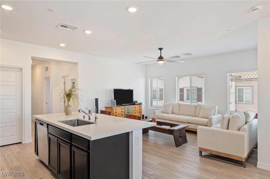 7230 North Decatur Boulevard, Unit 6 North Las Vegas, NV 89084 - Photo 5 of 27 Living room featuring a ceiling fan, recessed lighting, and light wood-style flooring