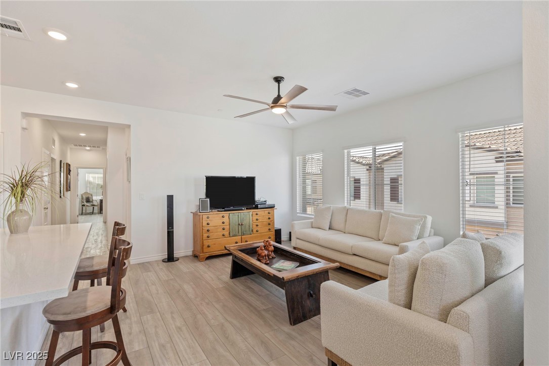7230 North Decatur Boulevard, Unit 6 North Las Vegas, NV 89084 - Photo 7 of 27 Living room featuring light wood finished floors, healthy amount of natural light, ceiling fan, and recessed lighting