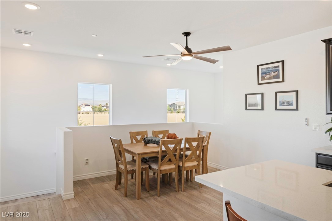 7230 North Decatur Boulevard, Unit 6 North Las Vegas, NV 89084 - Photo 8 of 27 Dining space featuring light wood-style flooring, recessed lighting, and ceiling fan