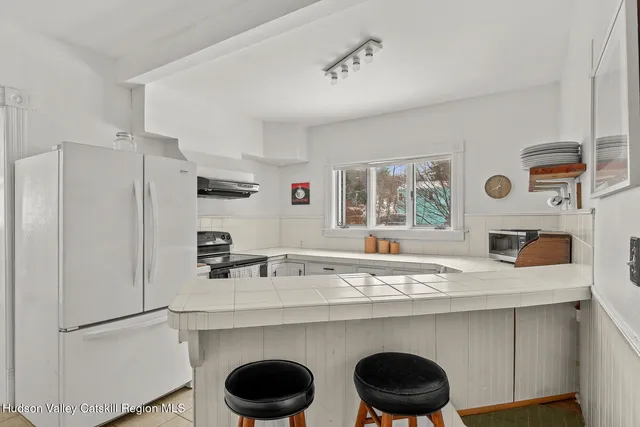 a utility room with a sink a washer and dryer