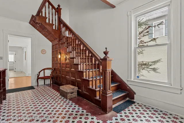 a view of entryway with an window and wooden floor
