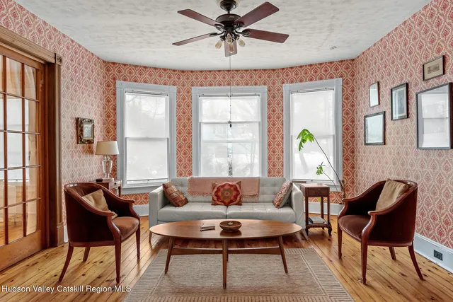 a living room with furniture and a window