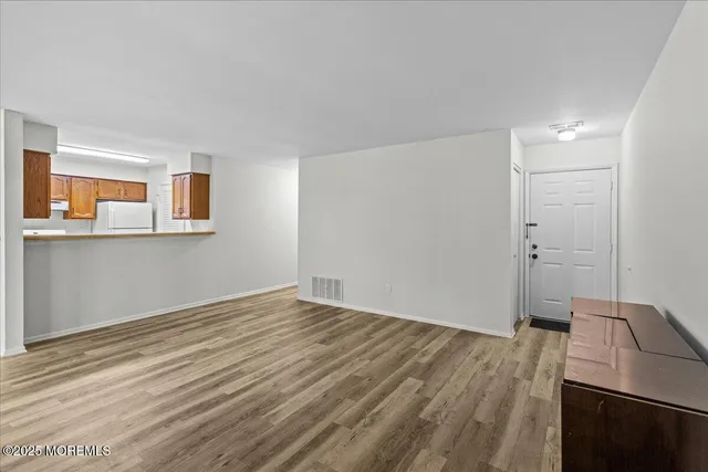 a view of a livingroom with wooden floor