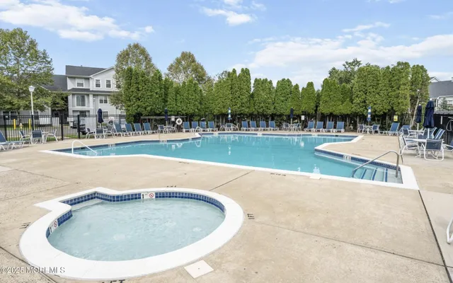 a view of a swimming pool with a yard