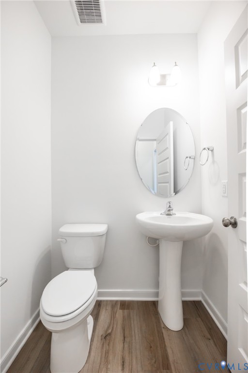 3731 Maze Runner Drive Midlothian, VA 23112 - Photo 18 of 32 a bathroom with a toilet sink and mirror