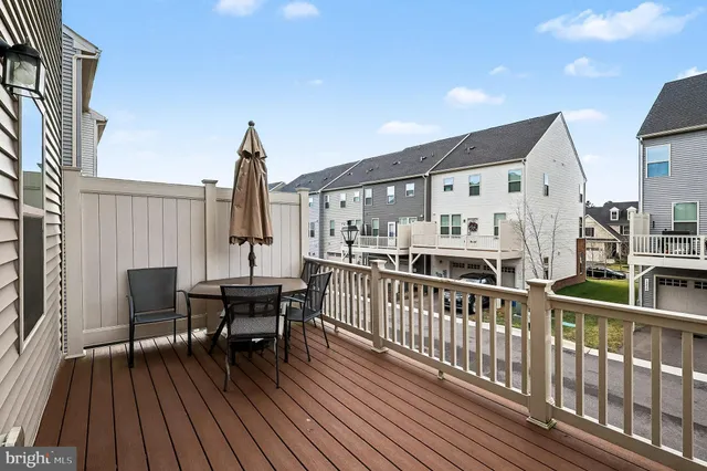 a view of a house with wooden deck
