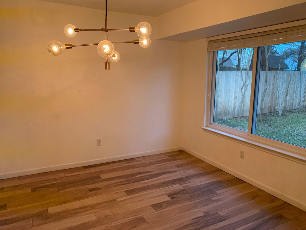 4404 Bouvet Court Austin, TX 78727 - Photo 5 of 16 a view of room with window and hardwood floor