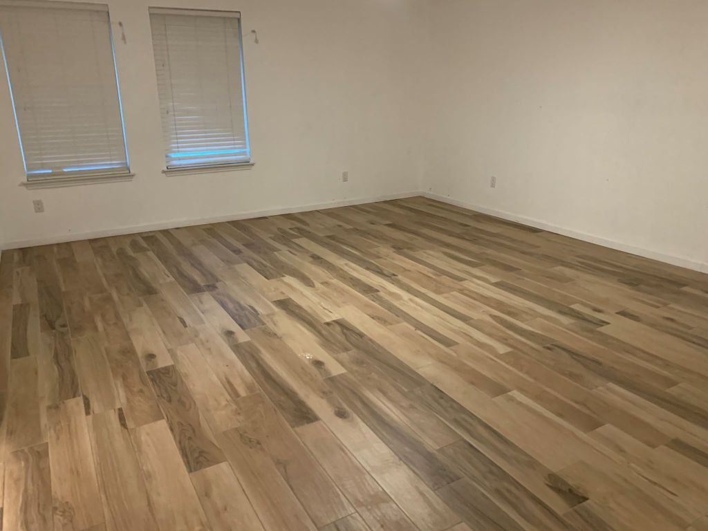 4404 Bouvet Court Austin, TX 78727 - Photo 8 of 16 a view of empty room with wooden floor and fan