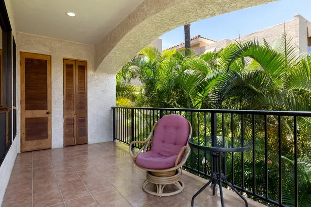 a view of a balcony with chair