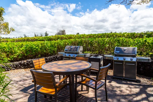 a chairs and table in a backyard