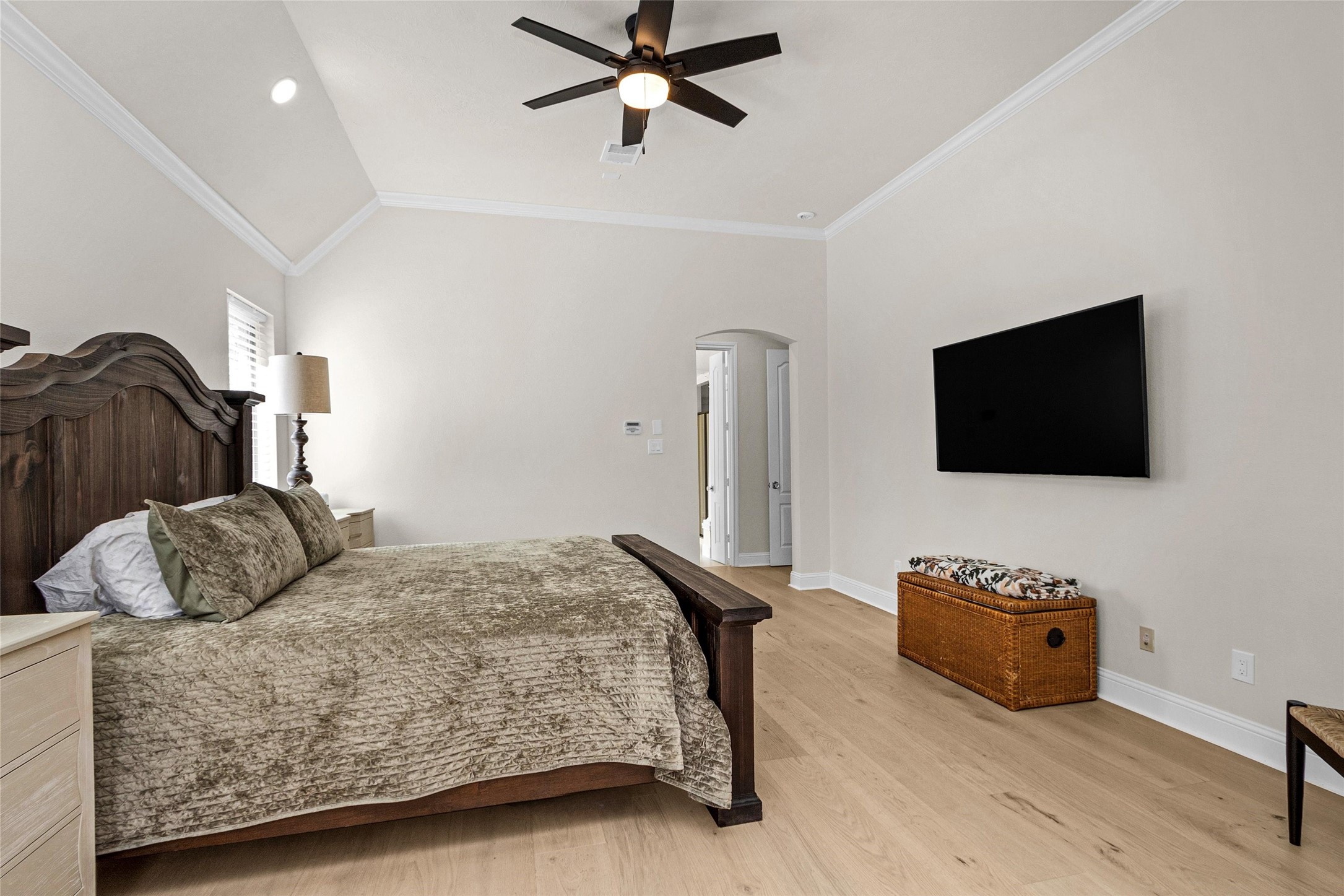 10004 Summer Ridge Lane Conroe, TX 77302 - Photo 27 of 50 a bedroom with a bed and a flat screen television