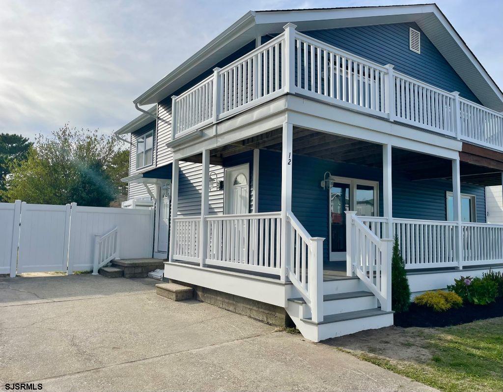 12 Lighthouse Drive, Unit A Brigantine, NJ 08203 - Photo 1 of 16 a view of a house with a yard