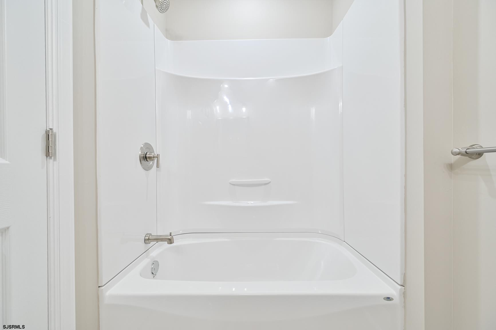 12 Lighthouse Drive, Unit A Brigantine, NJ 08203 - Photo 11 of 16 a close up of a bathtub in a bathroom