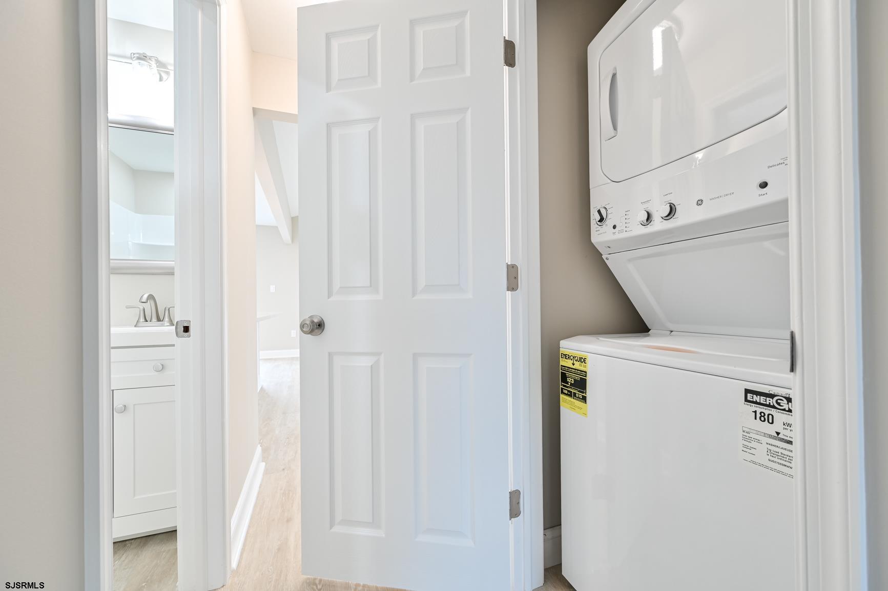 12 Lighthouse Drive, Unit A Brigantine, NJ 08203 - Photo 12 of 16 a utility room with dryer and washer