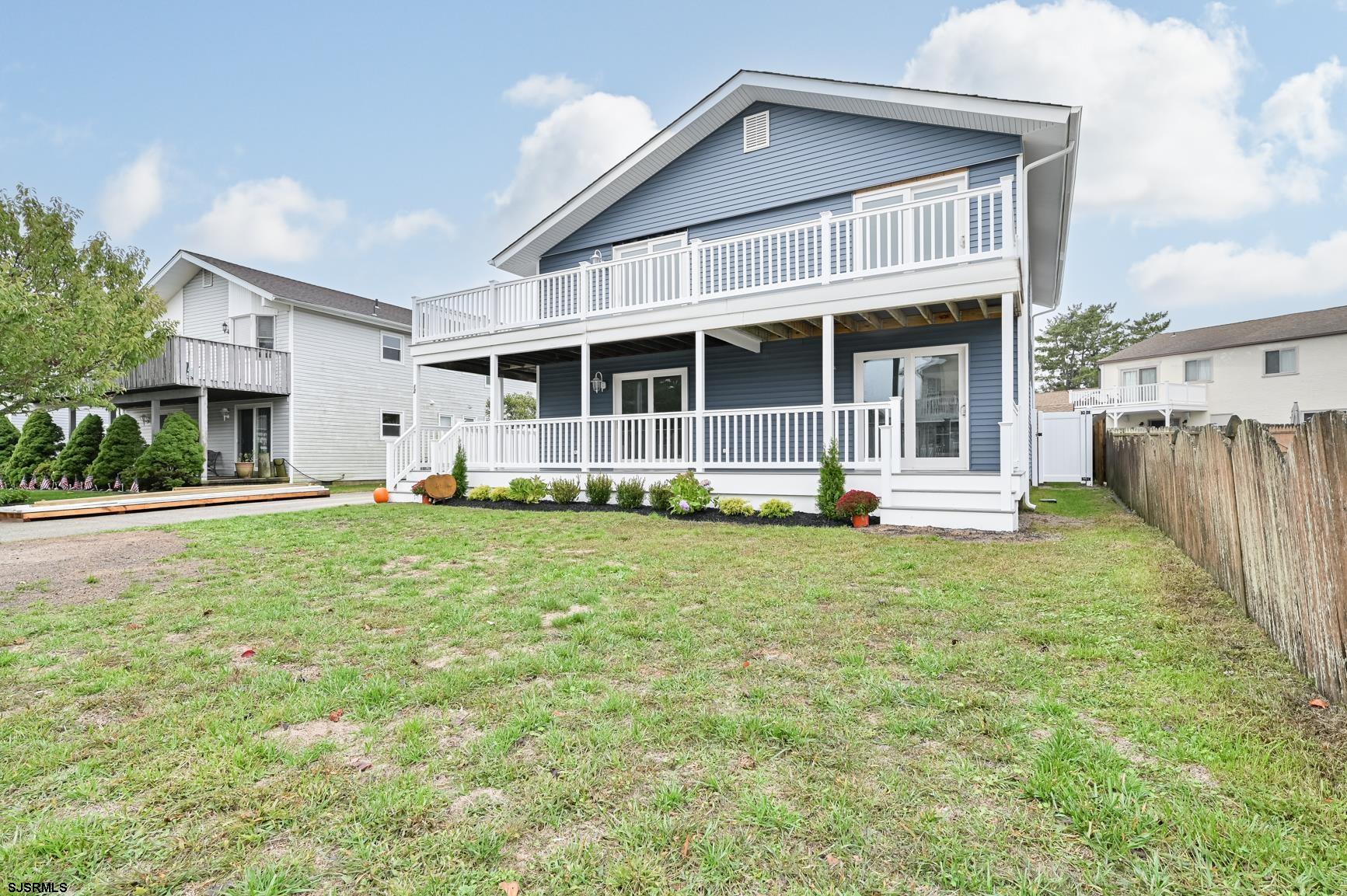 12 Lighthouse Drive, Unit A Brigantine, NJ 08203 - Photo 2 of 16 a front view of a house with a yard