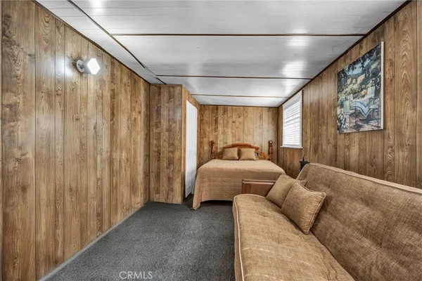 a bedroom with furniture and a window