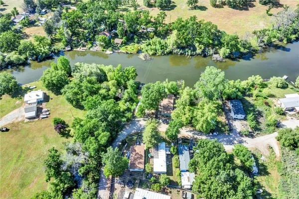an aerial view of a houses with yard