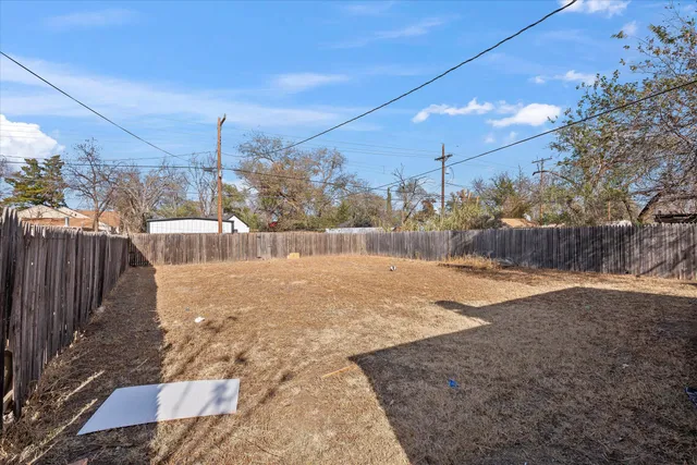 a view of a backyard of the house