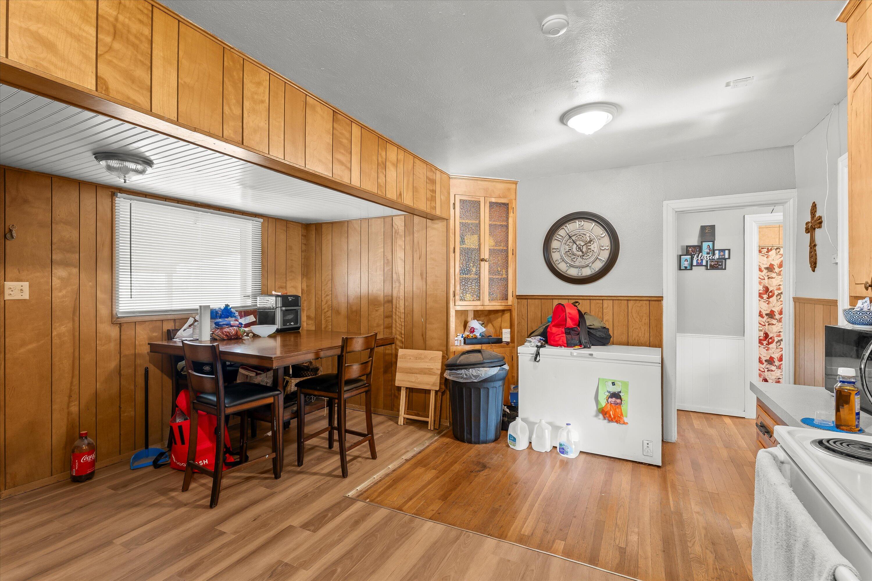 2222 22nd Street Lubbock, TX 79411 - Photo 8 of 16 a room with furniture and wooden floor