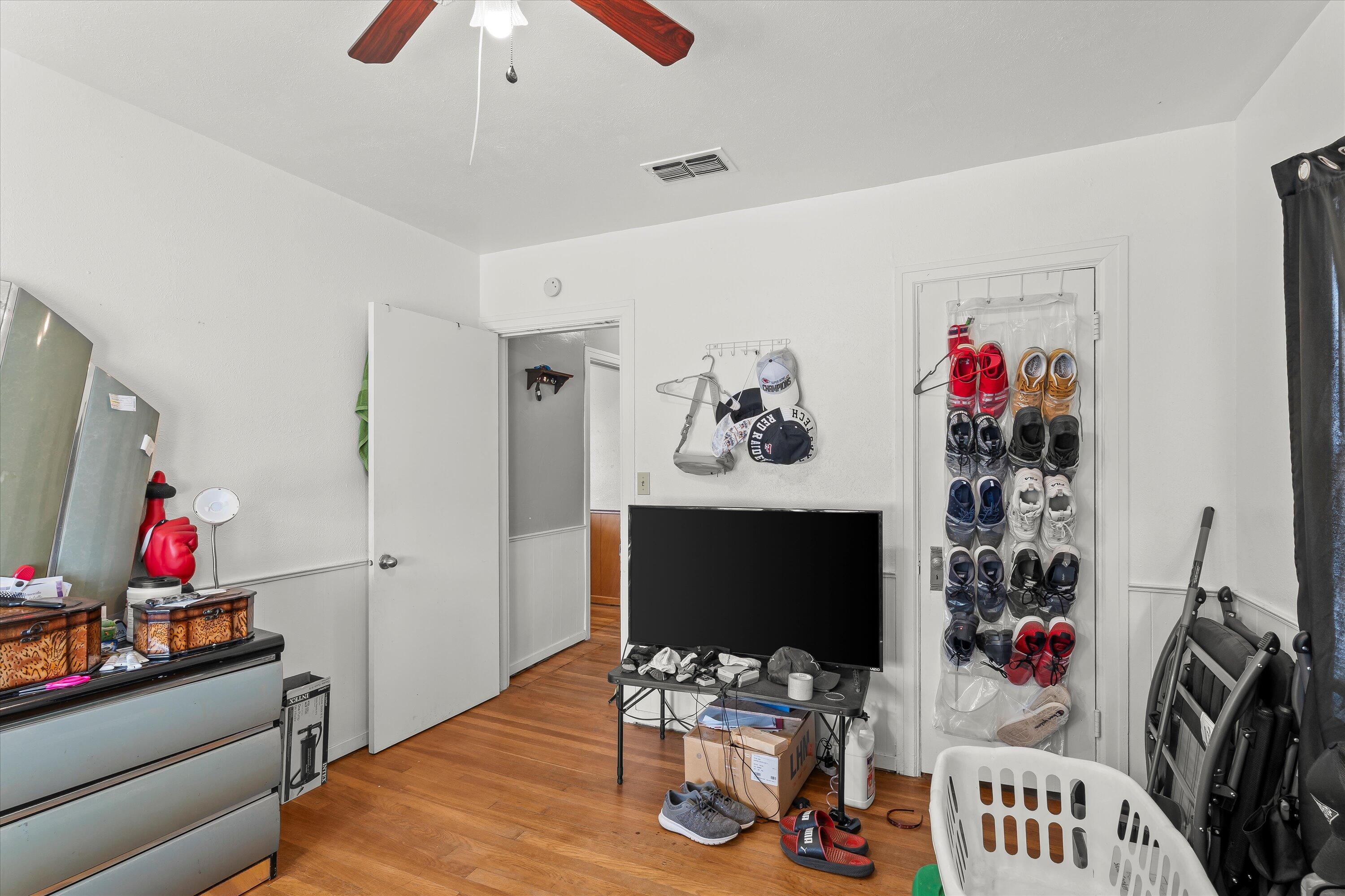 2222 22nd Street Lubbock, TX 79411 - Photo 10 of 16 a living room with furniture and a flat screen tv
