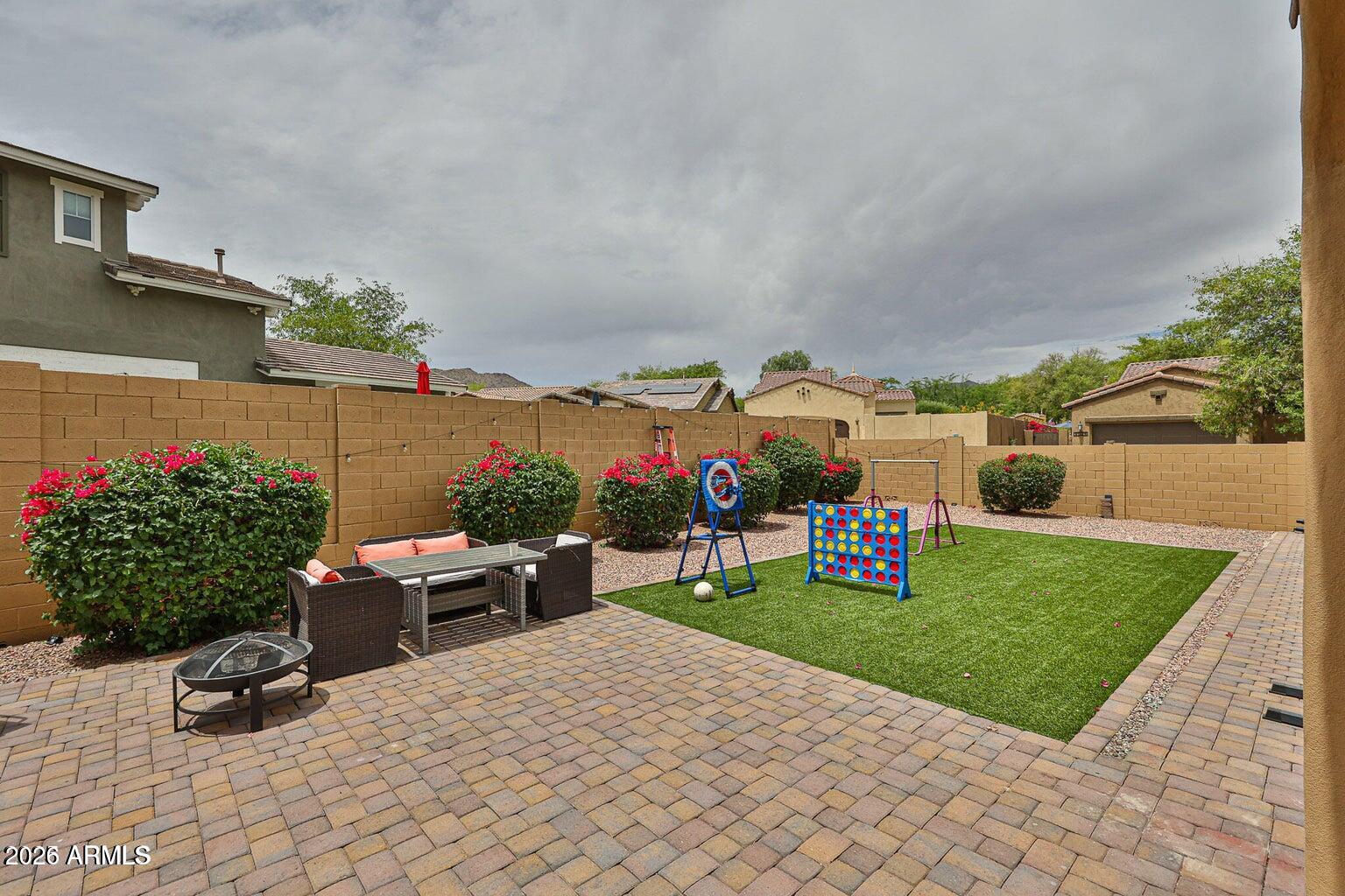 3950 North Edith Way Buckeye, AZ 85396 - Photo 24 of 32 a view of a backyard with sitting area