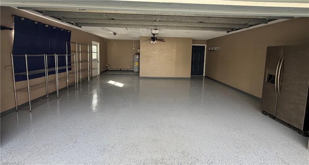 235 Cypress Way West Naples, FL 34110 - Photo 14 of 14 a view of a hallway with wooden stairs