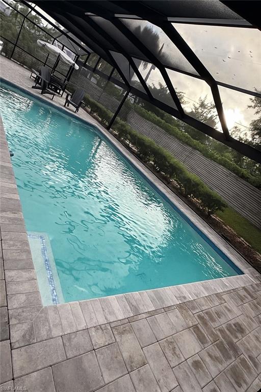 235 Cypress Way West Naples, FL 34110 - Photo 2 of 14 a view of swimming pool from a window