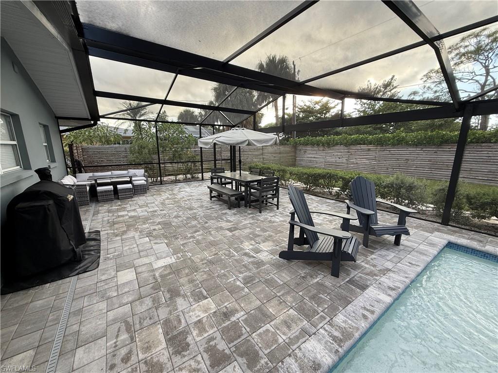 235 Cypress Way West Naples, FL 34110 - Photo 3 of 14 a view of a lake with outdoor seating
