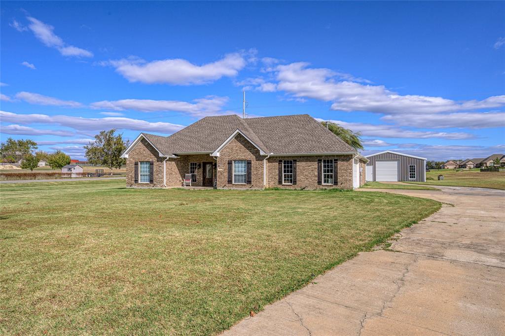 10264 Farmington Road Van Alstyne, TX 75495 - Photo 2 of 39 a view of house with garden