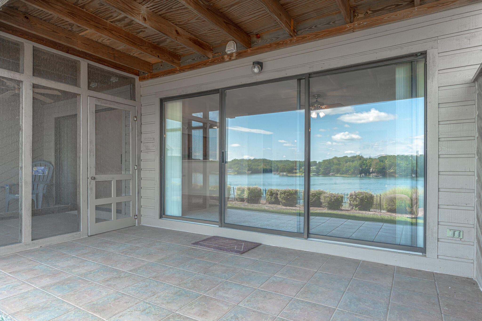 845 Gangplank Road, Unit 203 Moneta, VA 24121 - Photo 21 of 46 a view of an empty room with a sliding door